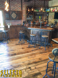 Bar area in Summit, New Jersey in Union County with wood floor and wood stools